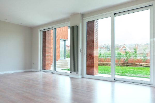Large living room with large windows overlooking the garden